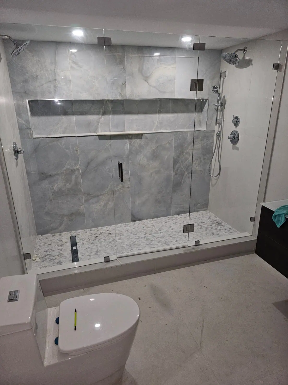Custom gray stone shower renovation